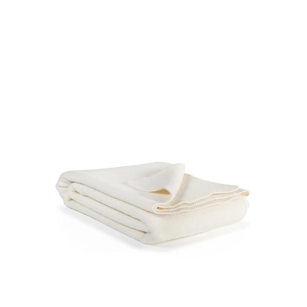 Crèmekleurige, wollen deken.